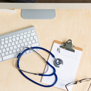 keyboard, stethoscope, and clipboard